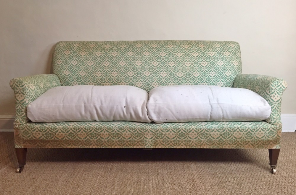 A Howard and Sons 2 seater sofa c 1930 in the original ticking.