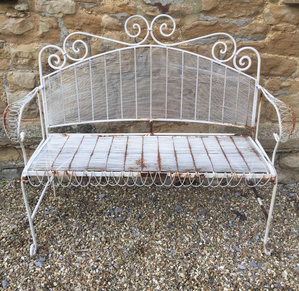 A 1920`s French iron and wire work garden folding two seater seat. 