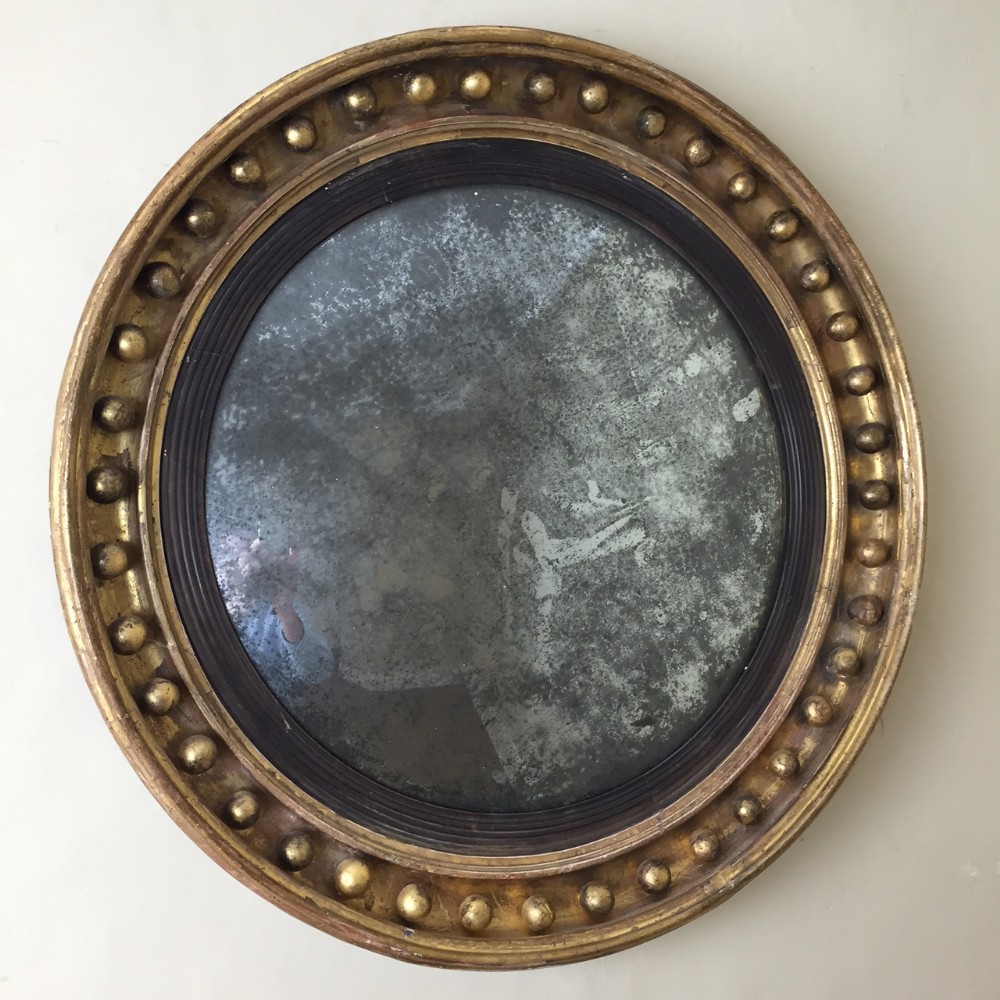 A good sized Regency gilt convex mirror circa 1815 