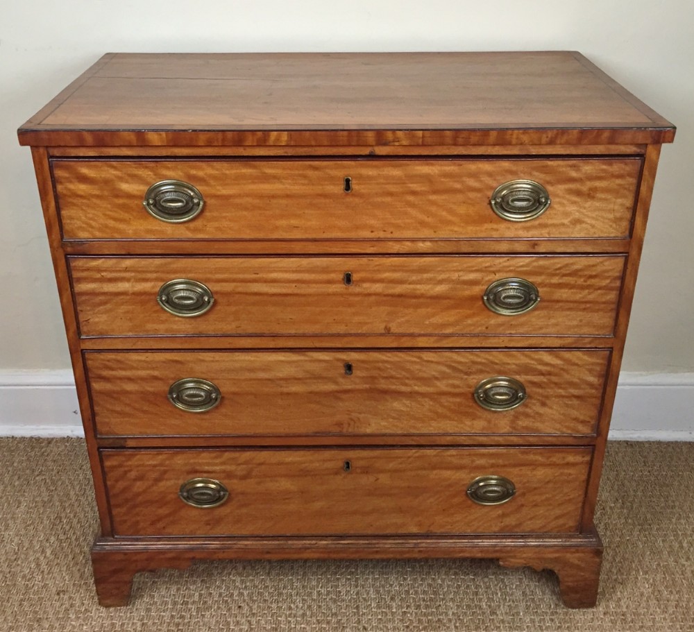 A small George 111 satin birch chest of drawers c 1800