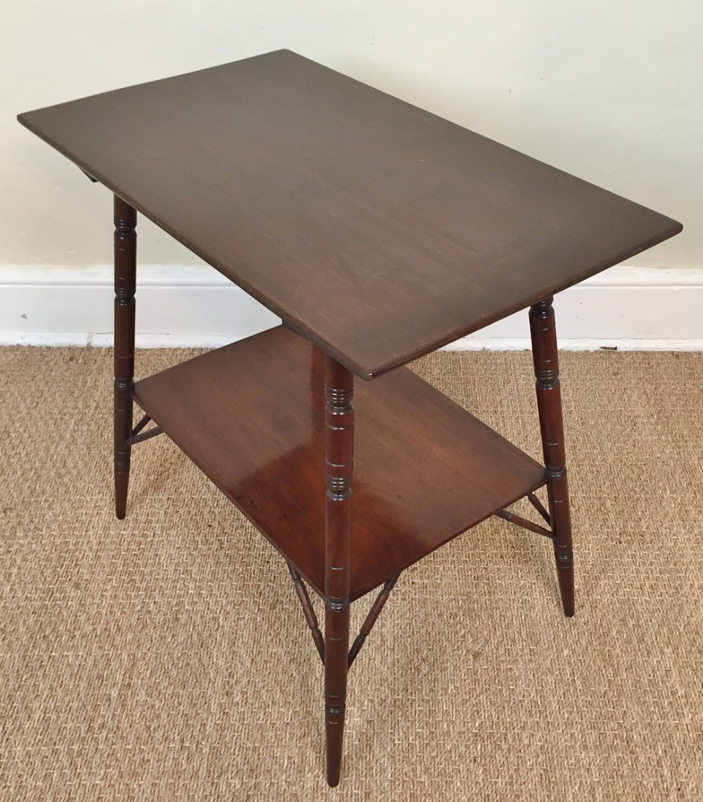 An Aesthetic movement walnut 2 tier rectangular table circa 1880 