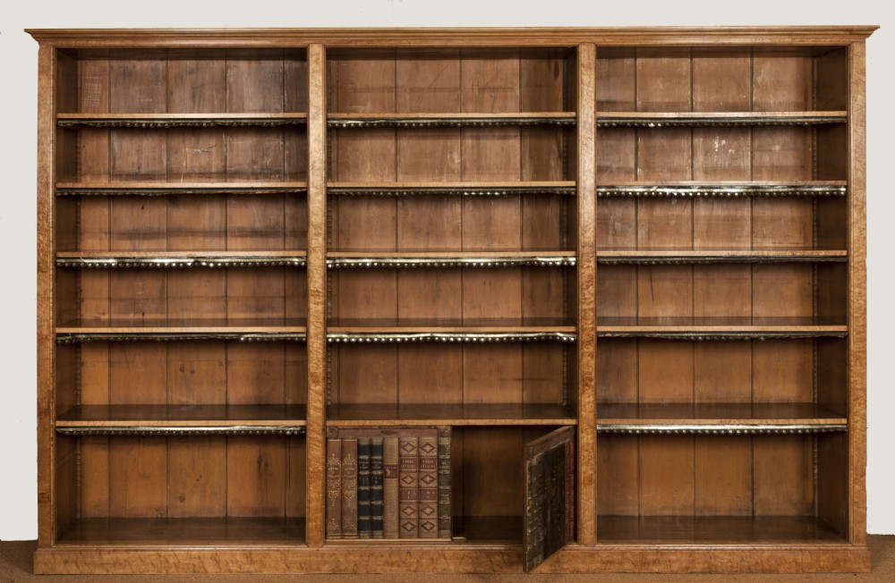 A magnificent pair of  Birdseye Maple library book cases by Holland and Sons c 1850