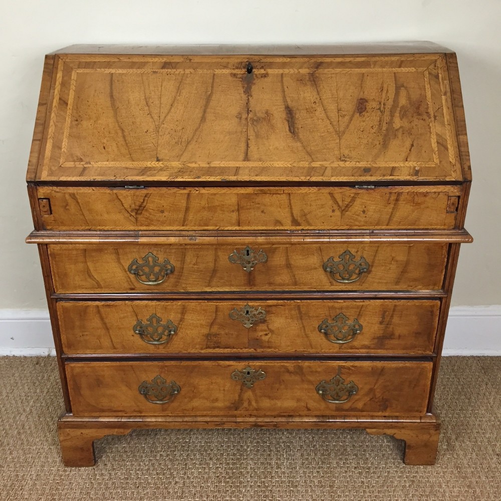 A small George 1 walnut bureau circa 1725