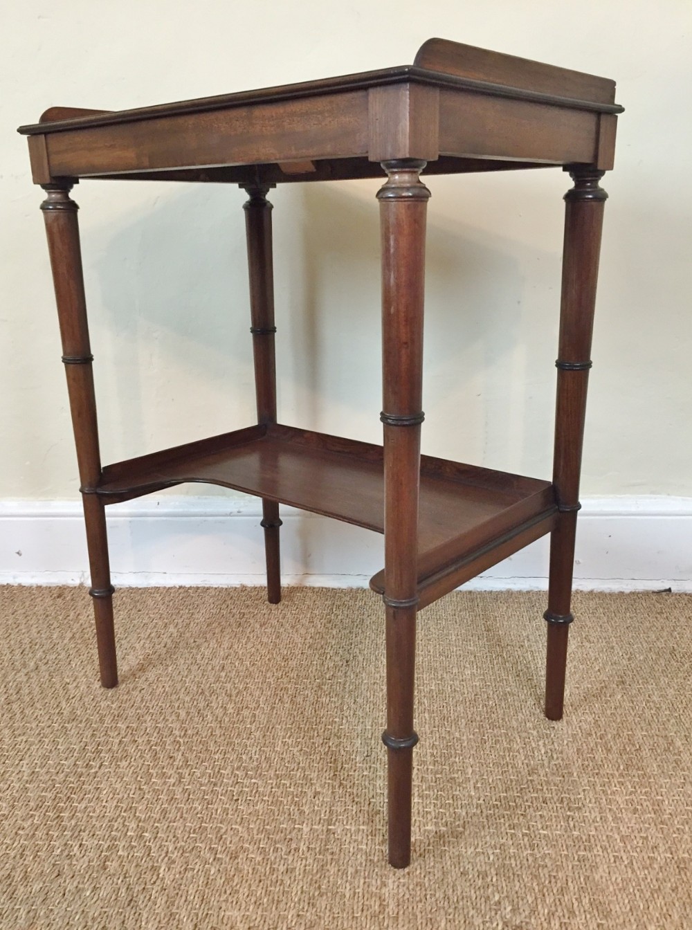 A George IV two tier mahogany side table circa 1825
