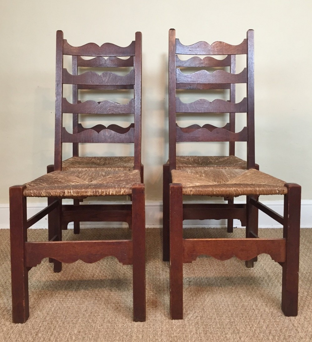 A rare set of four Heals oak Letchworth Chairs c 1905