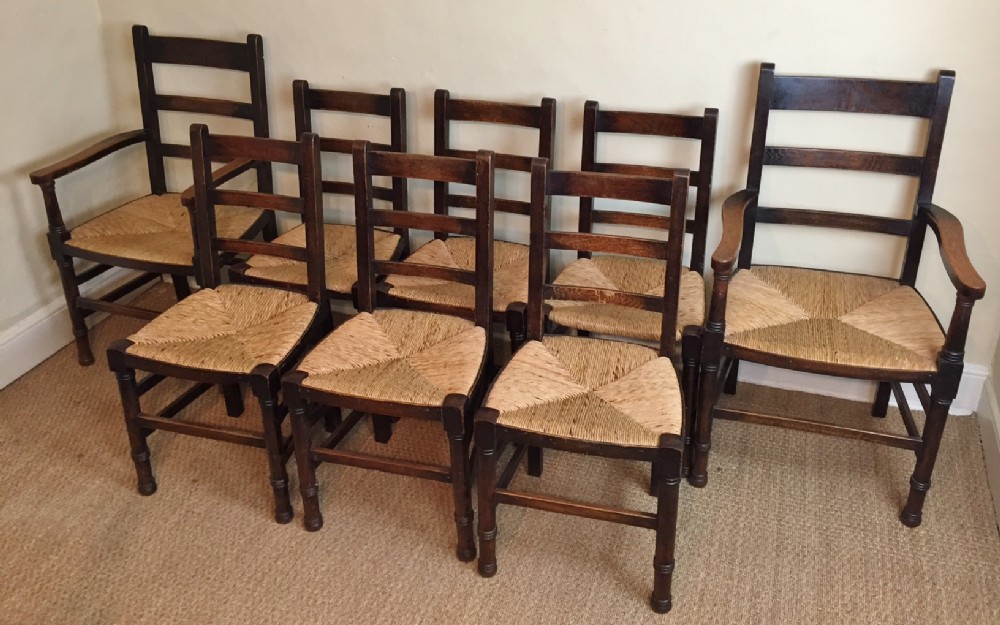 A set of 8 Arts and Crafts oak dining chairs c 1920
