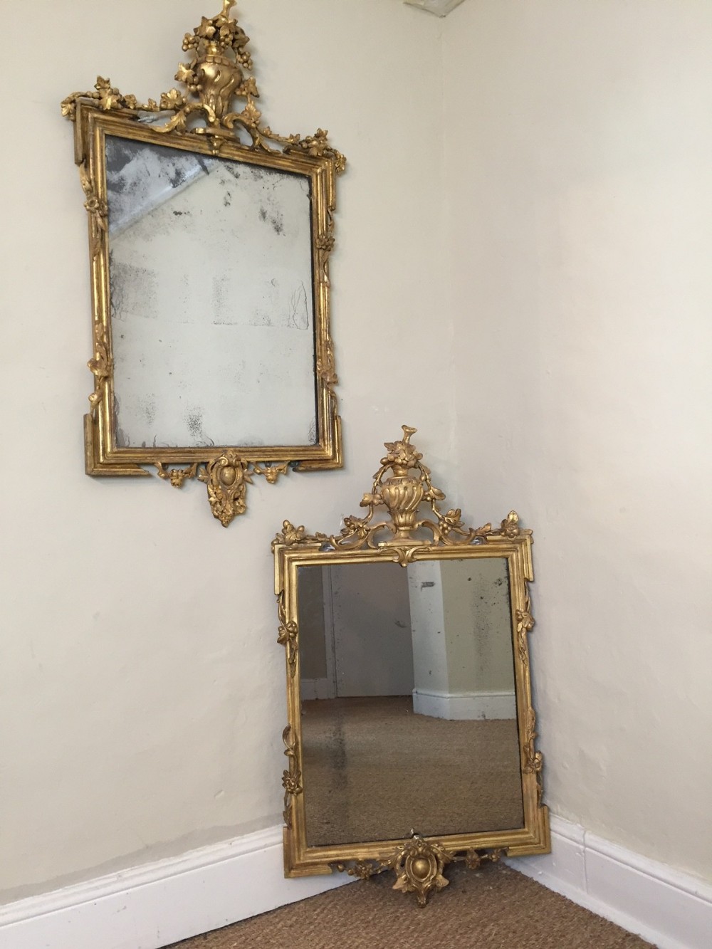 A matched pair of English water gilt mirrors c 1870