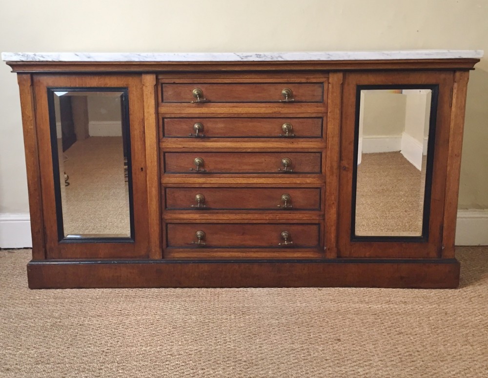 An Aesthetic movement oak and ebonised side cabinet c 1875