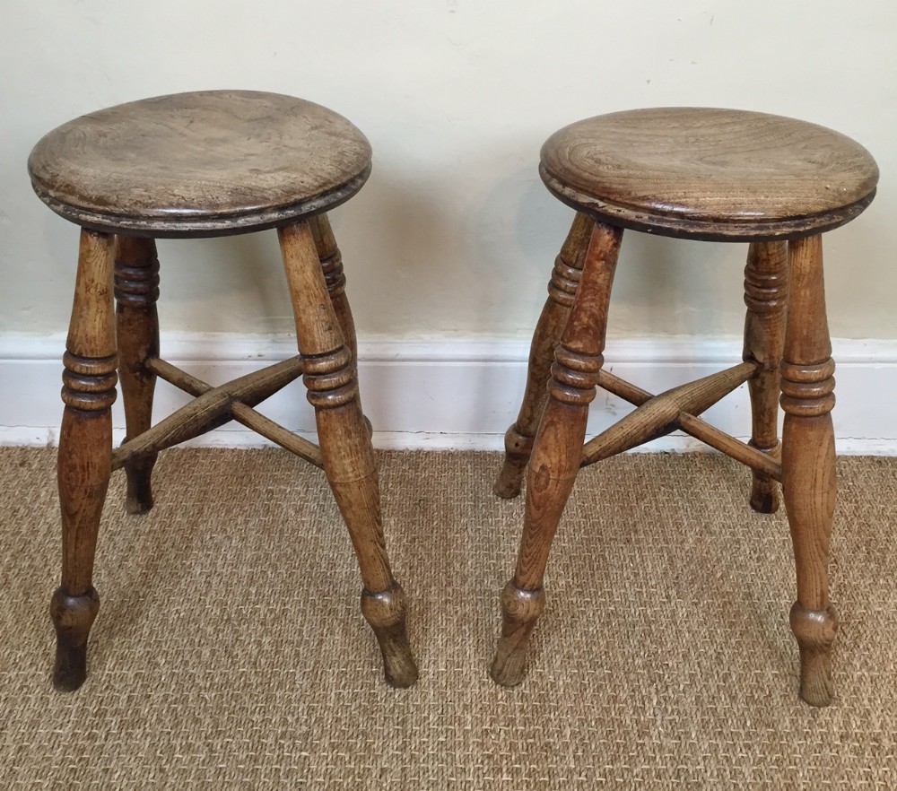 A pair of elm circular stools. English late 19th c