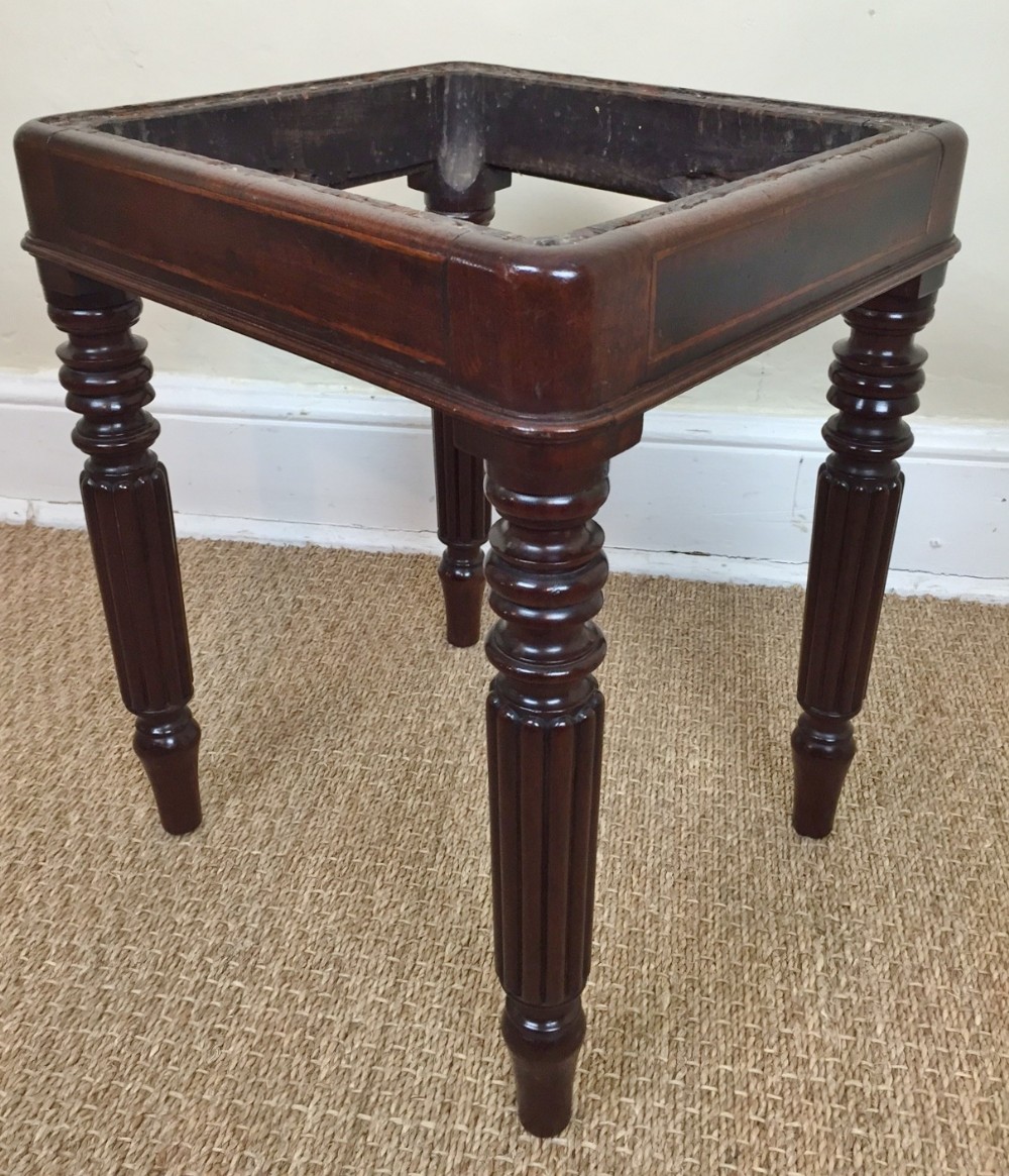 A late Regency mahogany and rosewood cross banded square stool c 1830