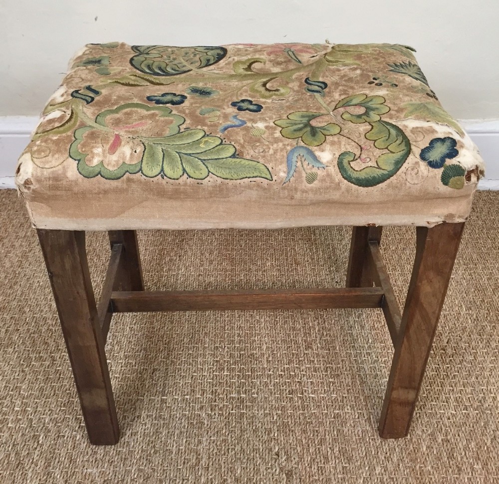 An early George 111 mahogany stool c 1770 with the original needlework top