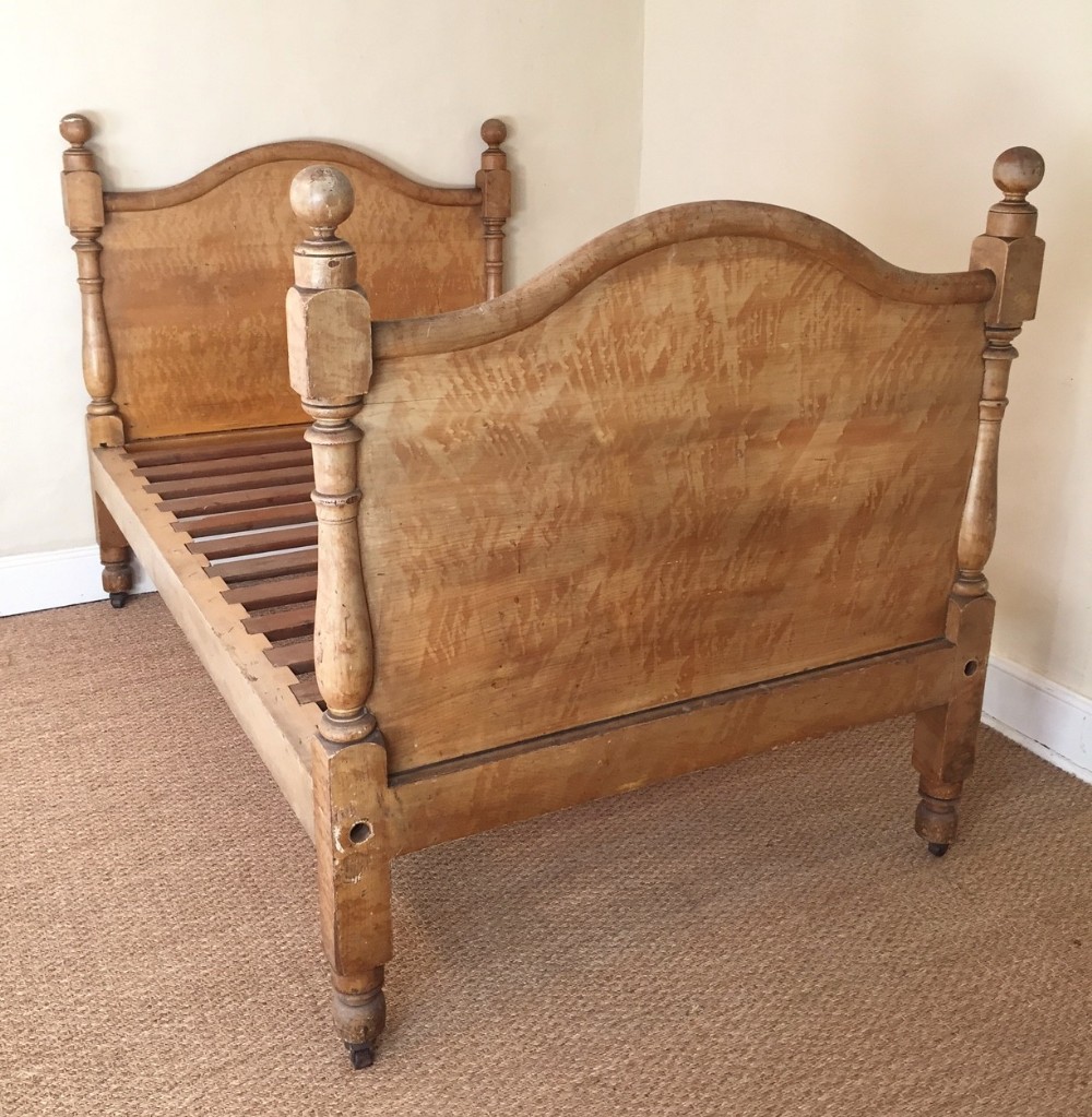 A mid 19th century West Country bed in simulated maple c 1860