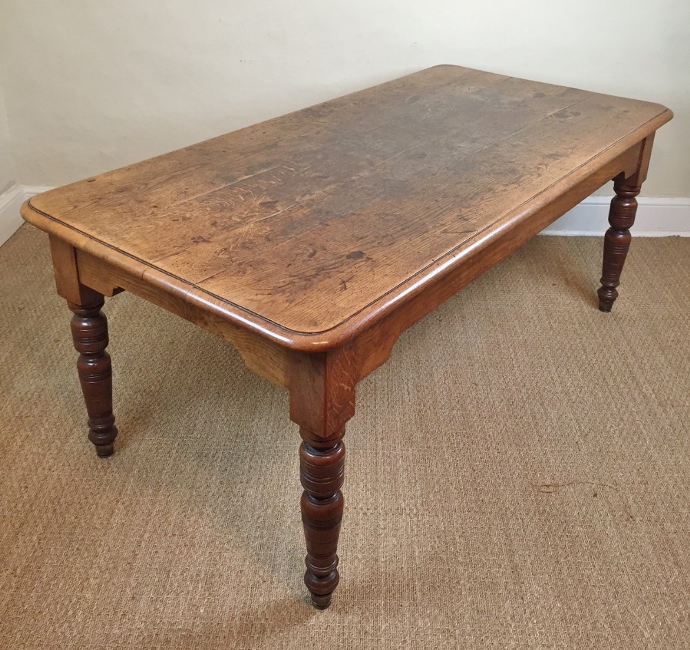 A beautifully figured late 19th c country house oak refectory table c 1880