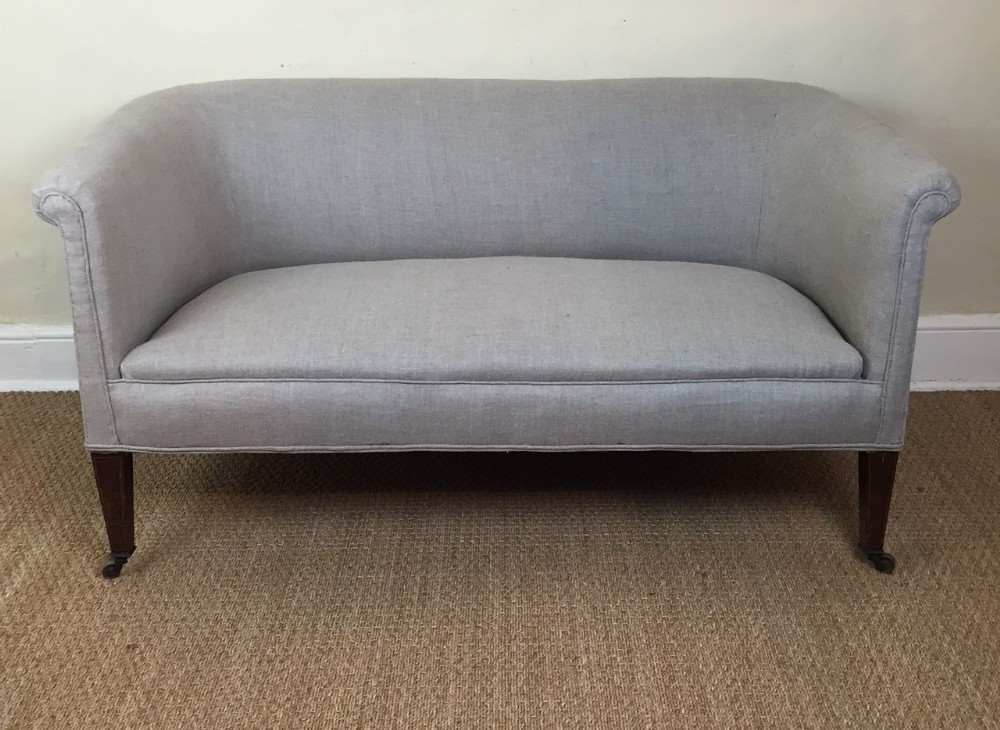 A small Edwardian two seater mahogany sofa circa 1910 