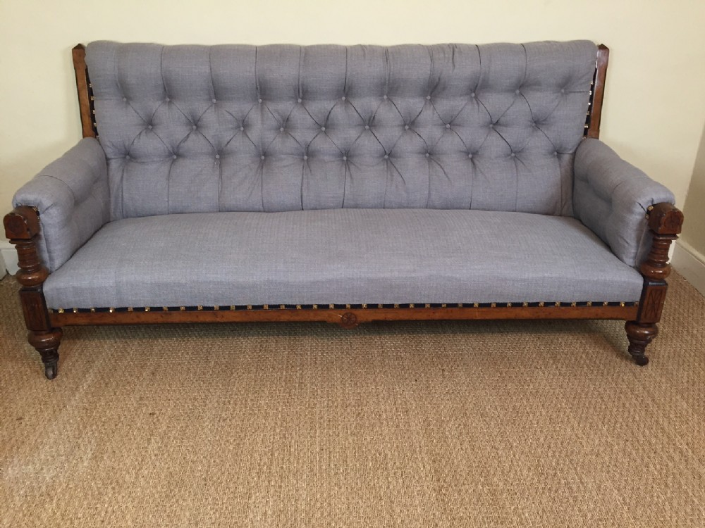 A Gothic reform oak and ebonised sofa circa 1875