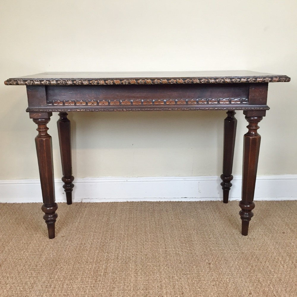 A William IV oak console table c 1835 in the antiquarian manner.
