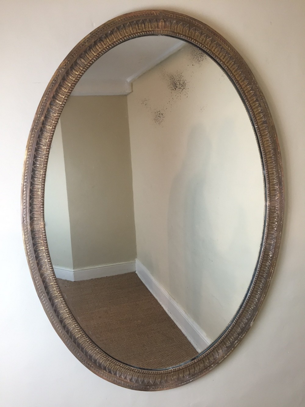 A large English oval water gilt mirror c 1870