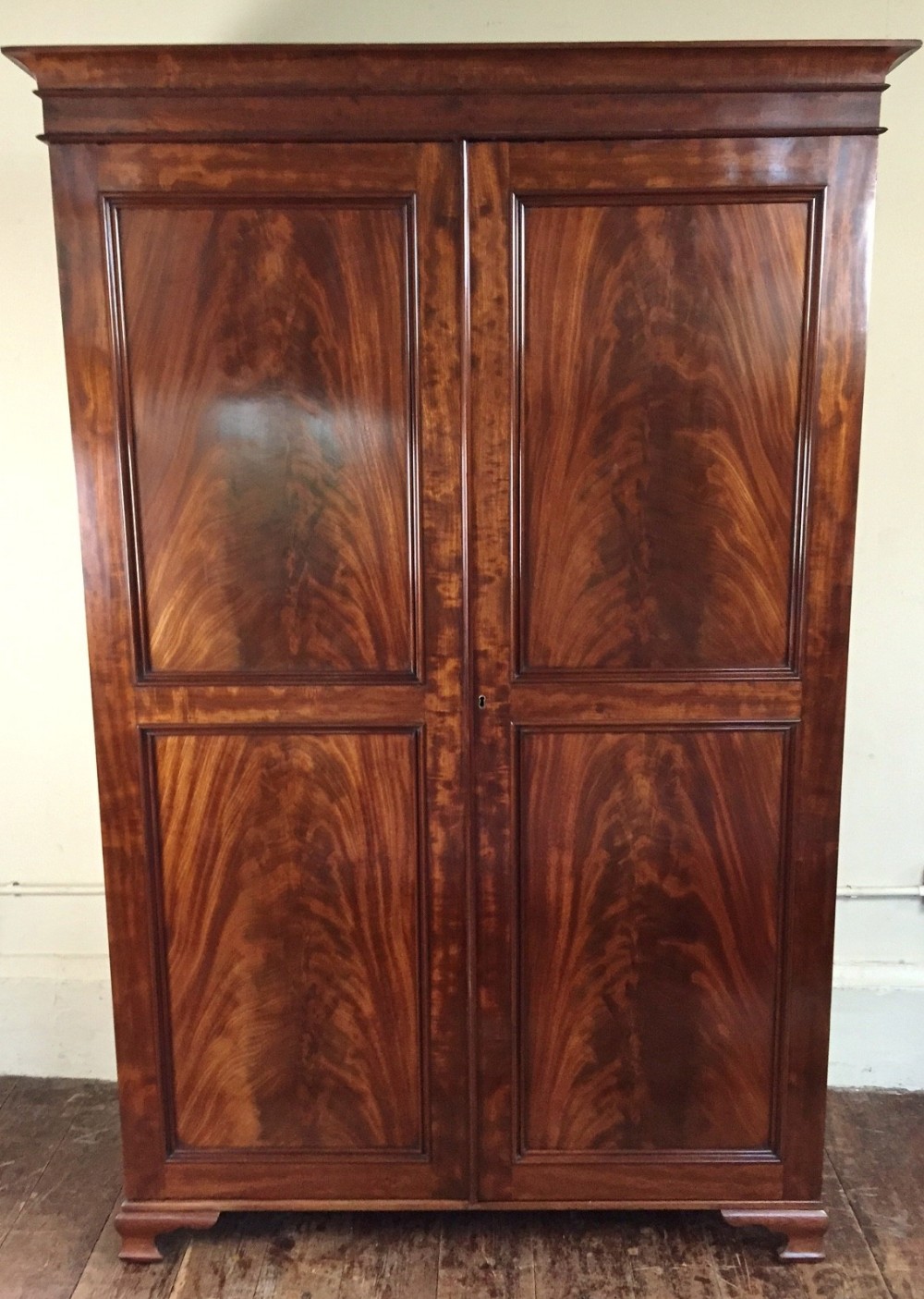 A William IV mahogany 2 door compactum wardrobe c 1835