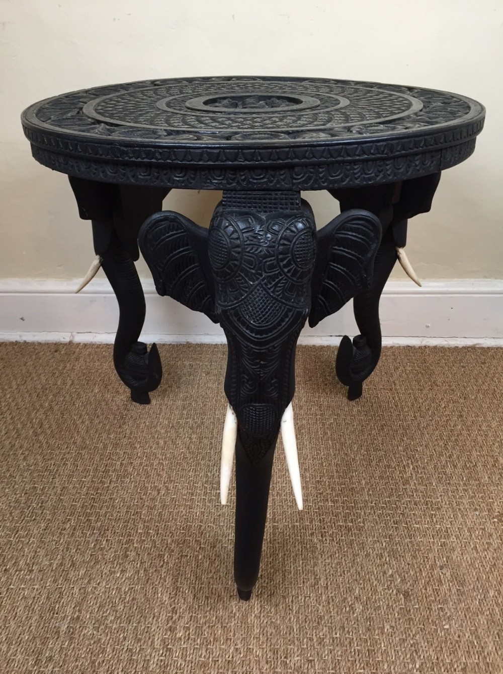 A Bombay Blackwood circular carved elephant table circa 1910 