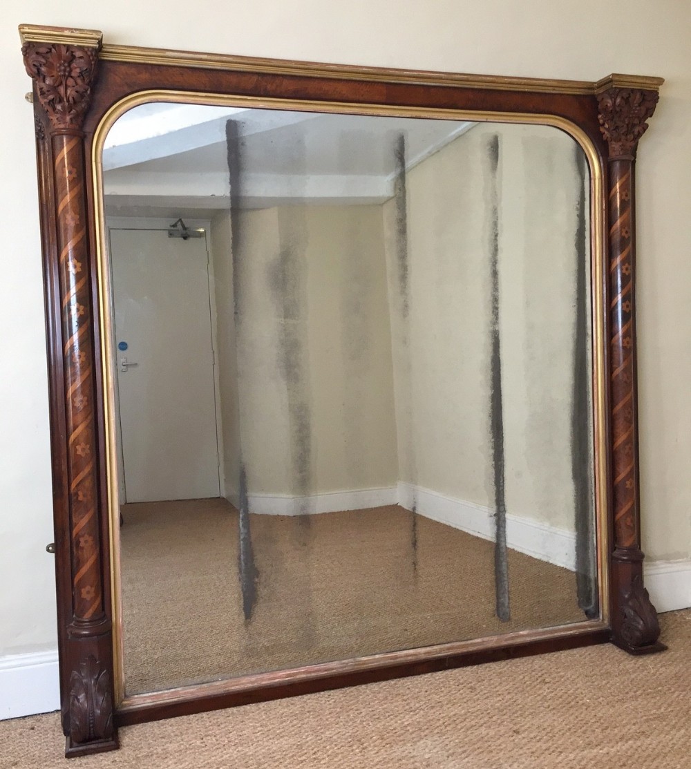 An impressive large Gothic walnut oak and parcel gilt over mantle mirror circa 1858