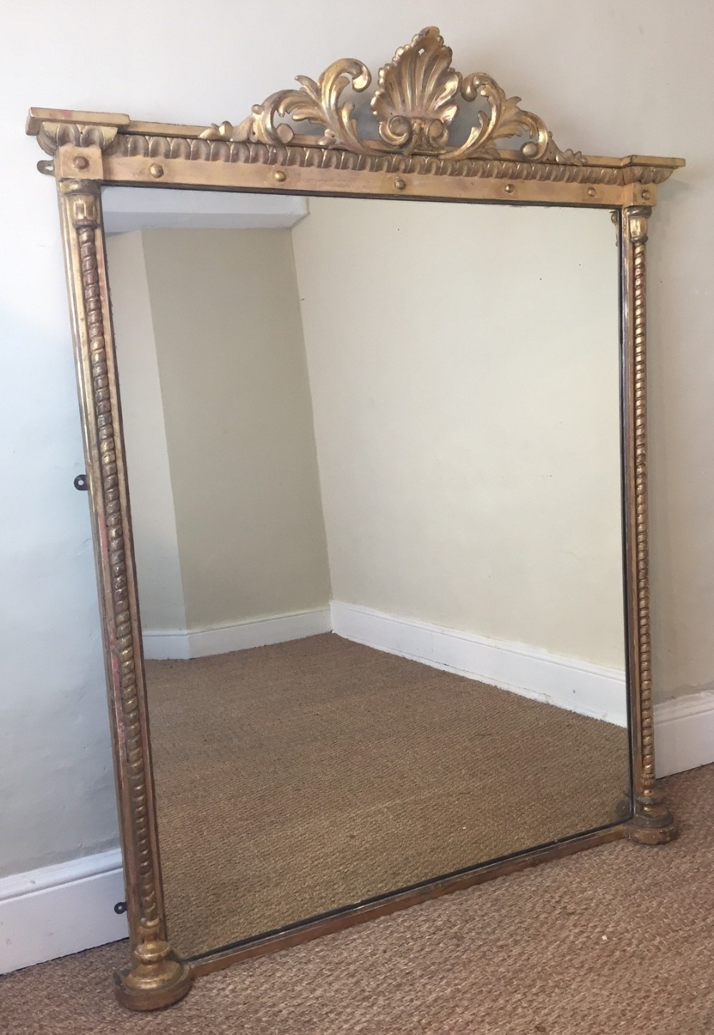 An early Victorian giltwood overmantel mirror circa 1850 with water gilding and original silvered plate