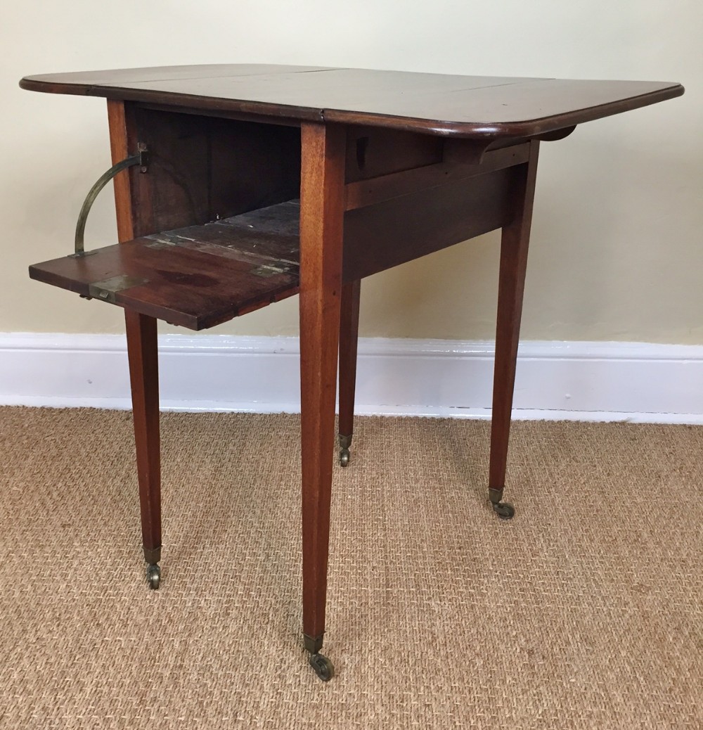 A George 111 mahogany drop flap night table c 1790
