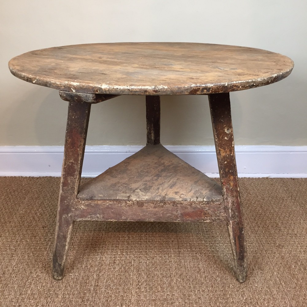 An Early 19th c West Country painted pine Cricket table c 1830