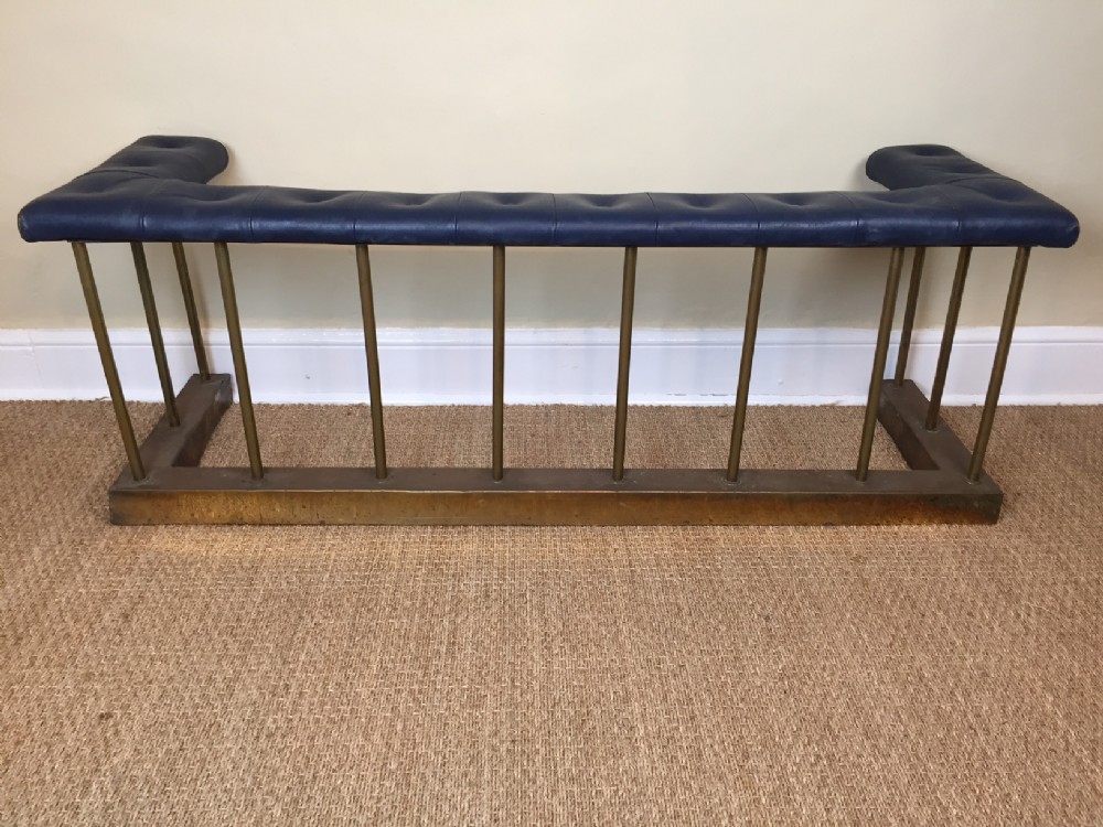 An Edwardian anodised brass club fender circa 1910