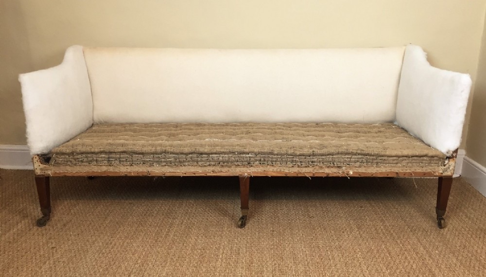 A late 19th century mahogany three seater sofa in Sheraton style