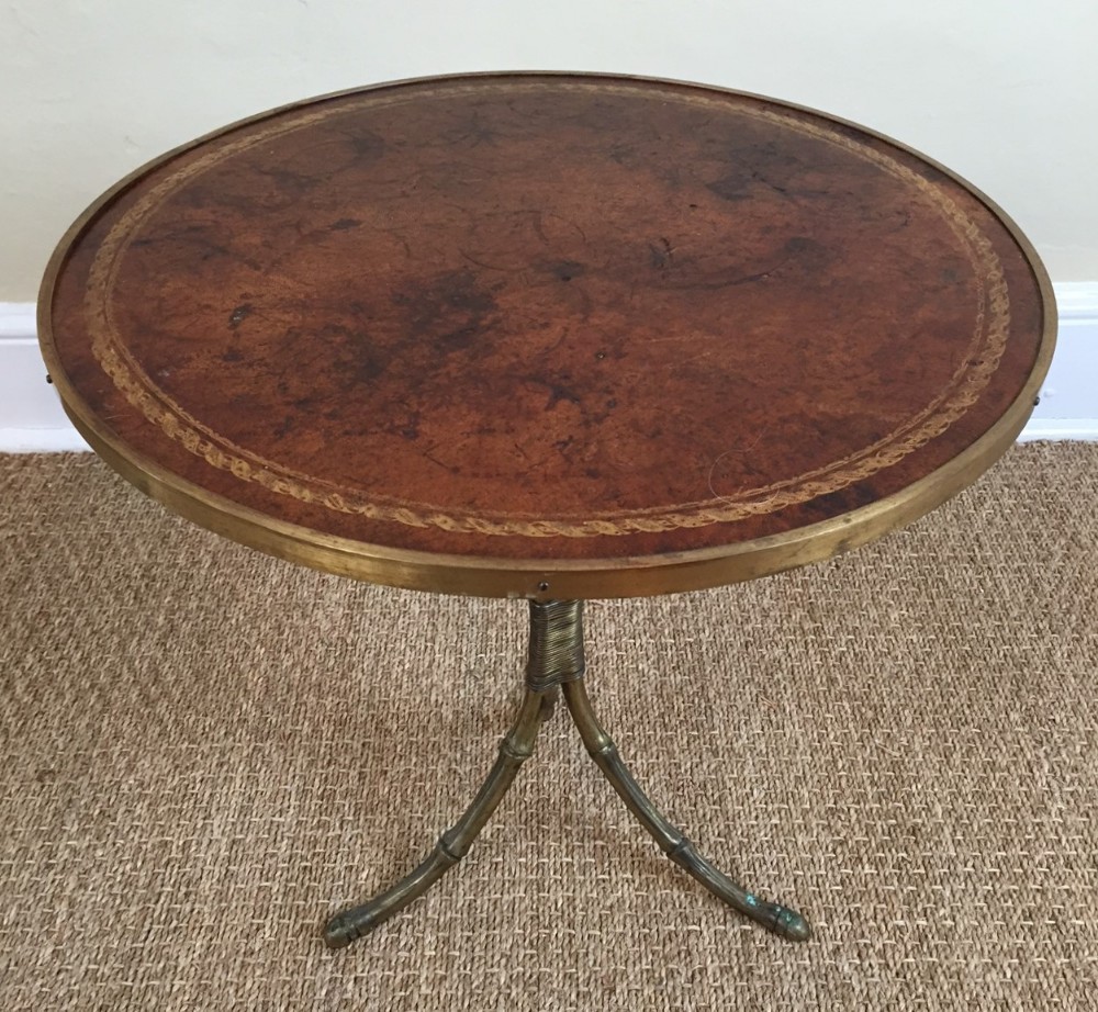 A leather and brass circular lamp or coffee table English circa 1920.