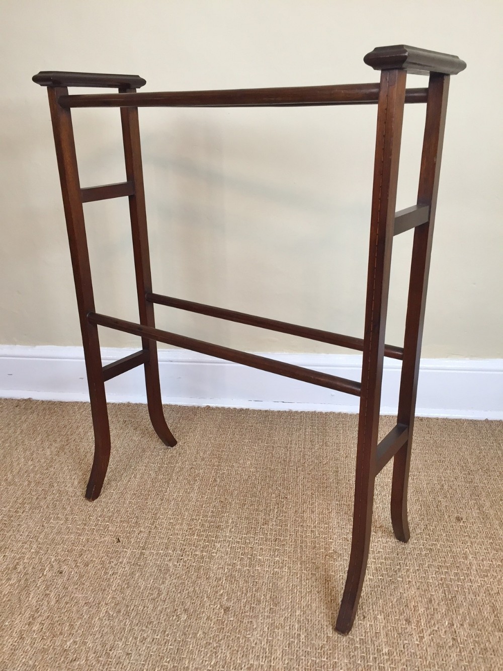An Edwardian mahogany and boxwood strung towel rail c 1910 