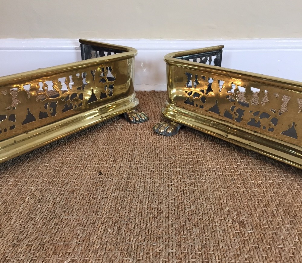 A pair of Regency brass and iron kerb fenders circa 1820