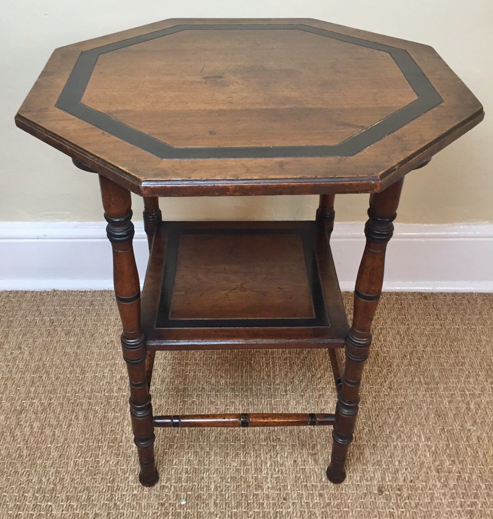  An Aesthetic movement walnut ebonised and parcel gilt octagonal table after a design by E W Godwin circa 1880