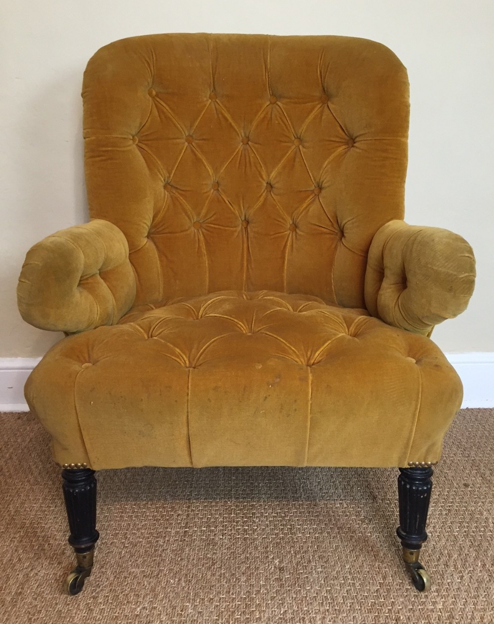 A large George IV ebonised library chair circa 1830 