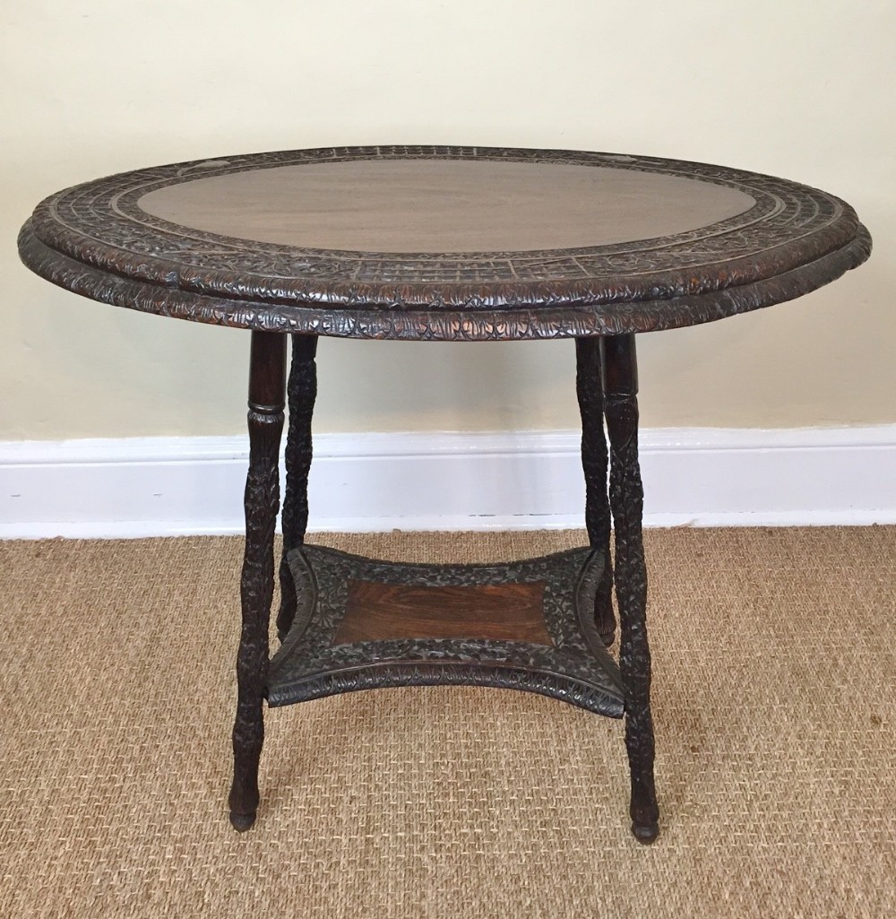 An Indian carved teak oval table. Bombay c 1910