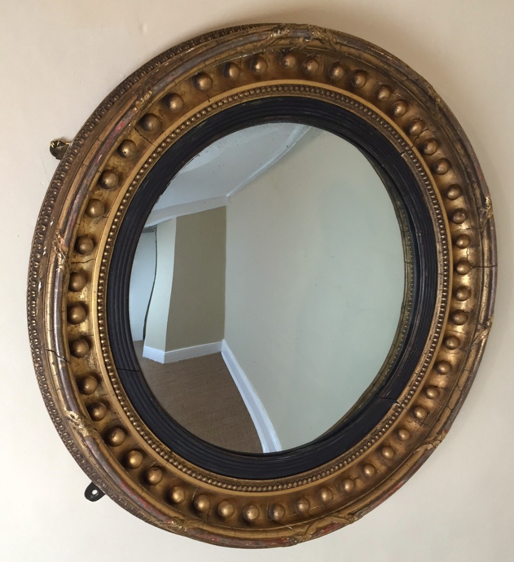 A Regency gilt convex mirror c 1820 in lovely original condition