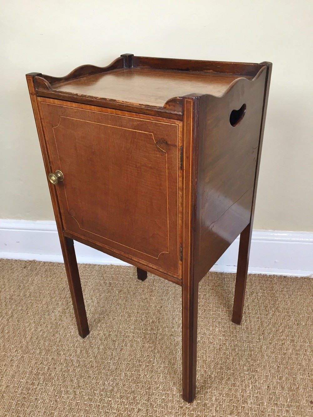A George 111 mahogany and boxwood strung bedside table circa 1800.