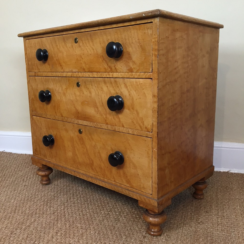 A small Victorian simulated Birdseye Maple chest of drawers circa 1870