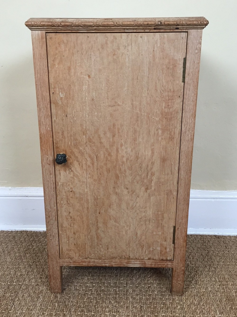 A Heals limed oak bedside cupboard circa 1930