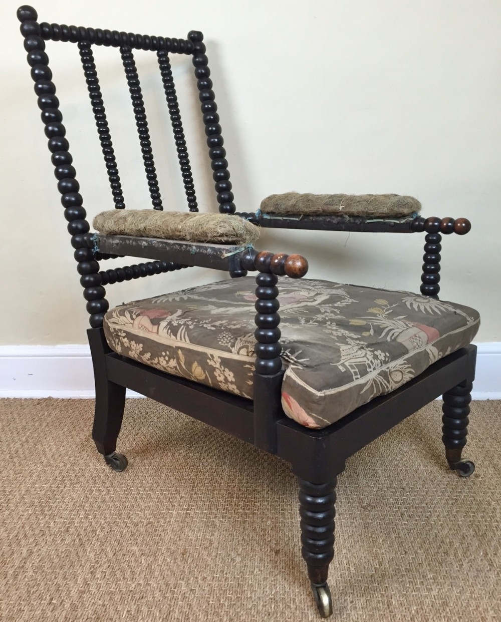 A large mid 19th century ebonised beech bobbin armchair circa 1840 