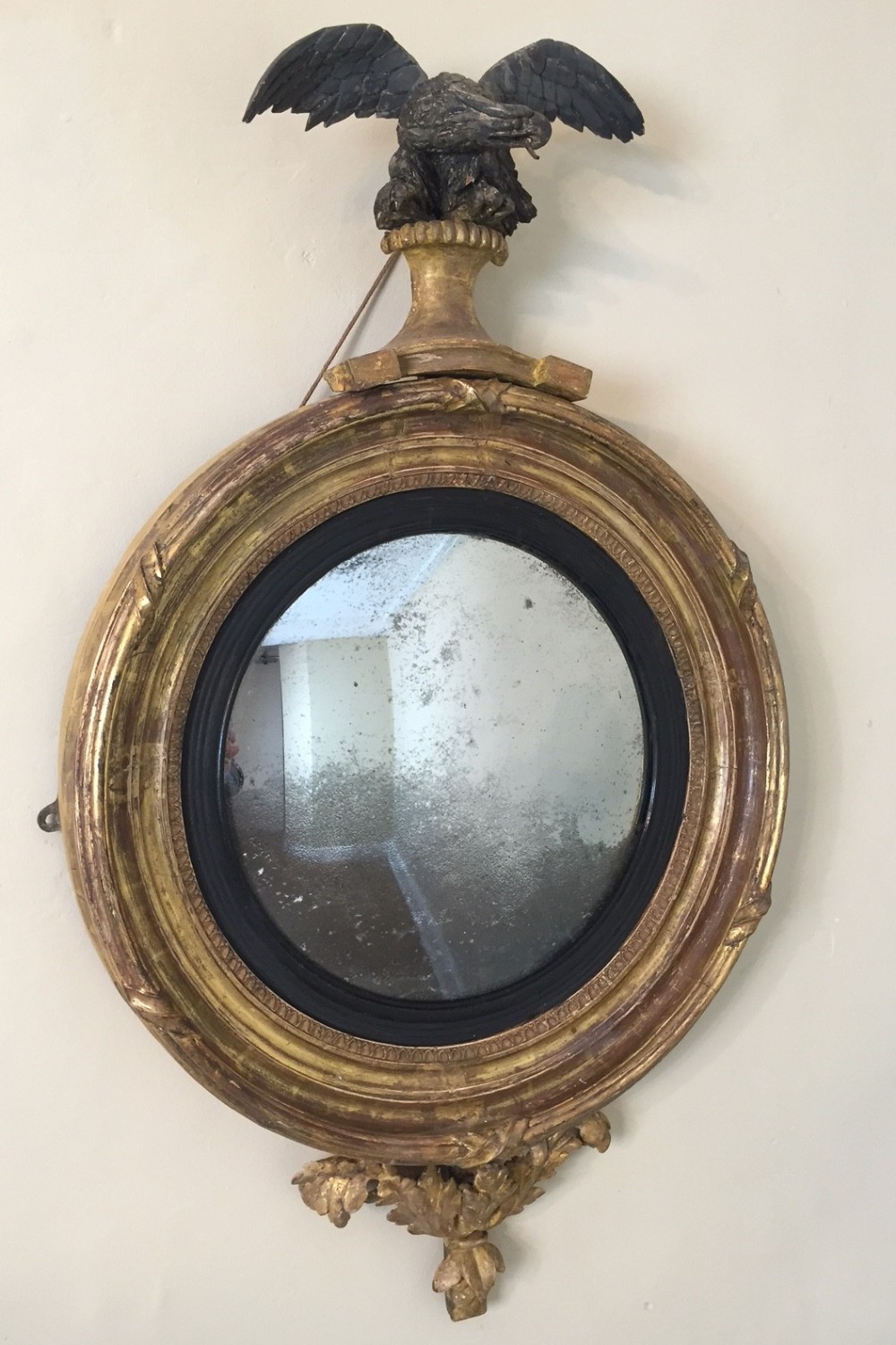 A small Regency gilt wood convex mirror c 1810 