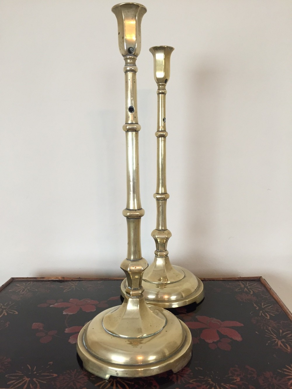 A pair of late George 111 Brass tall candlesticks circa 1820