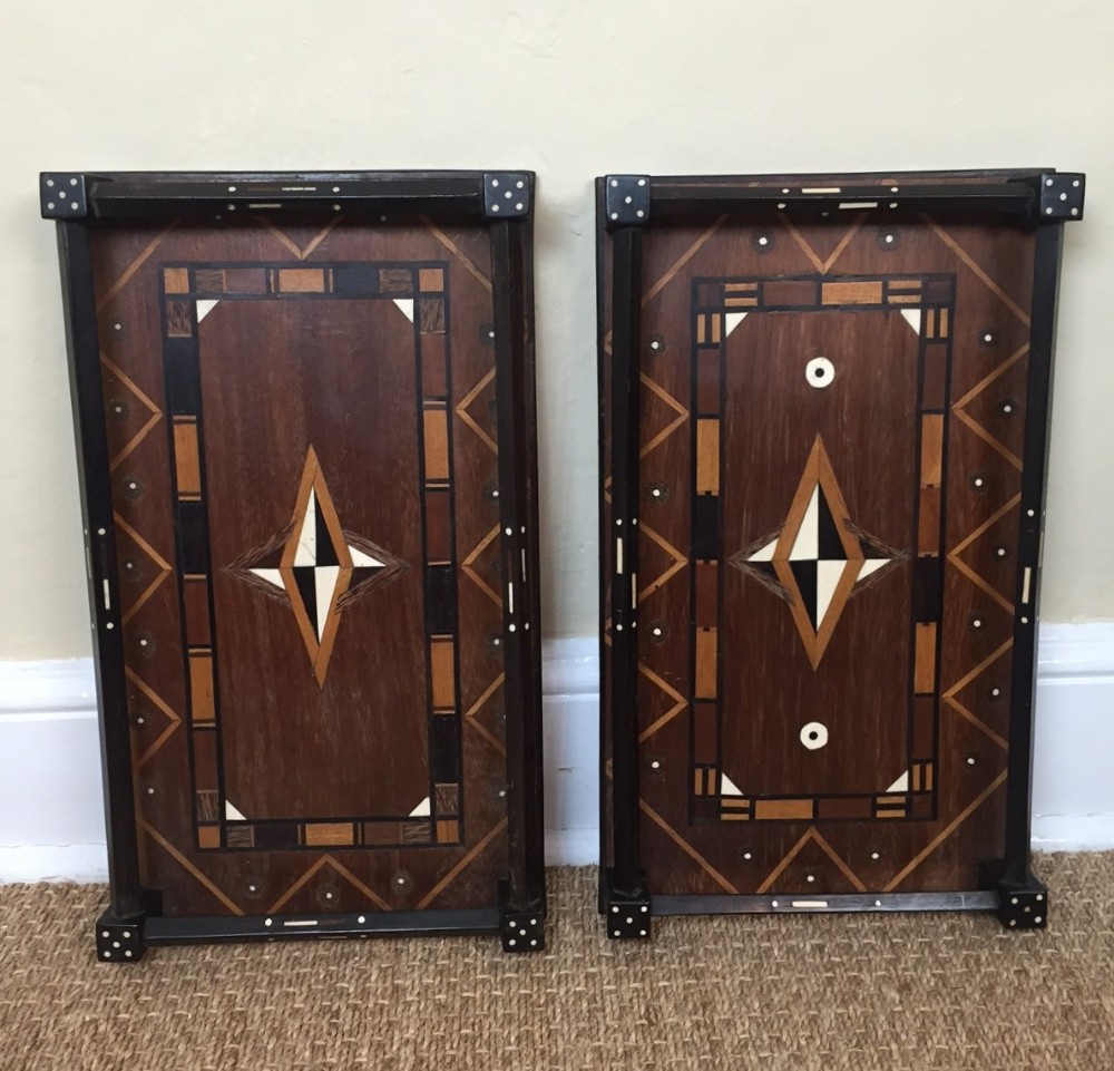 A pair of Indian teak bone and ebony trays circa 1920. Ceylonese.