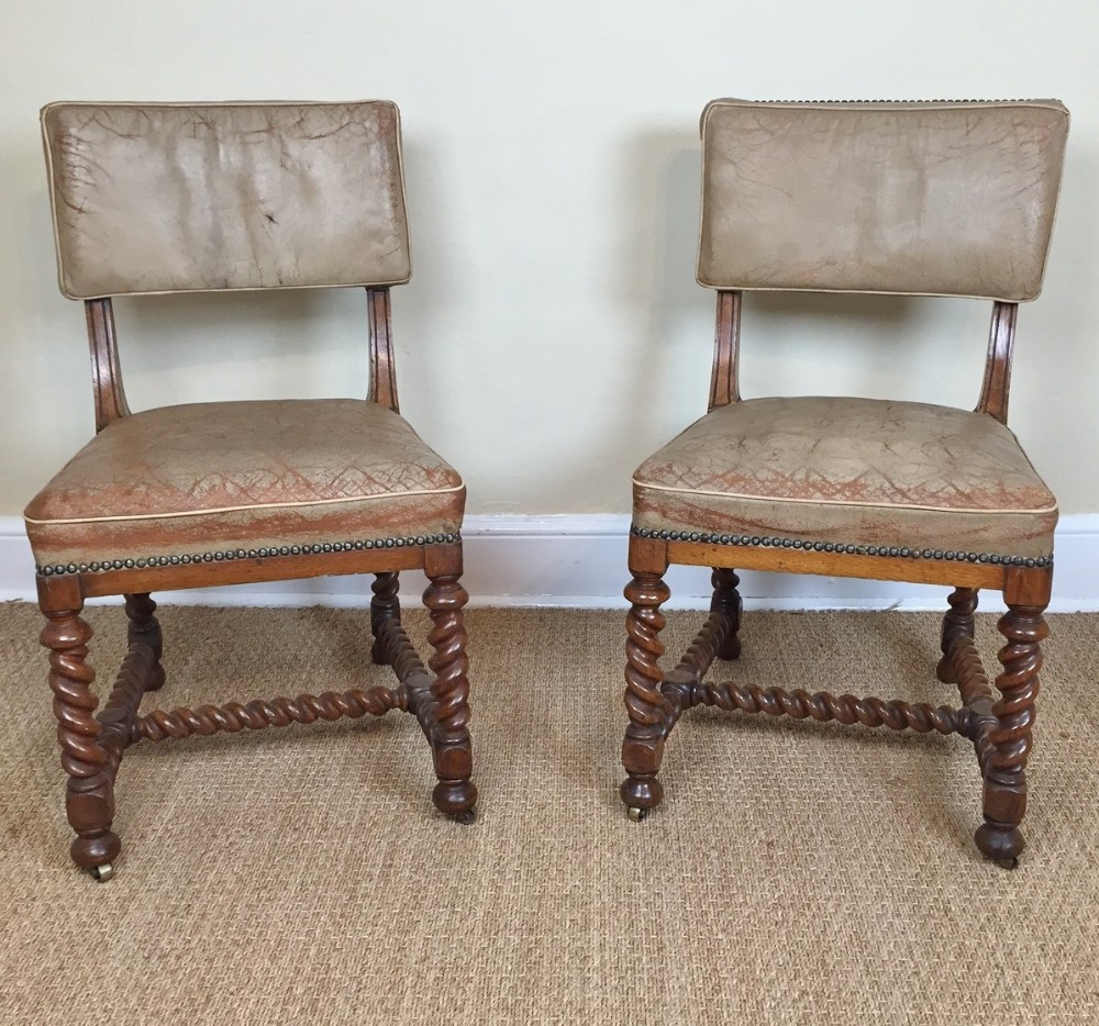 A pair of Victorian oak and leather bobbin turned side chairs circa 1870