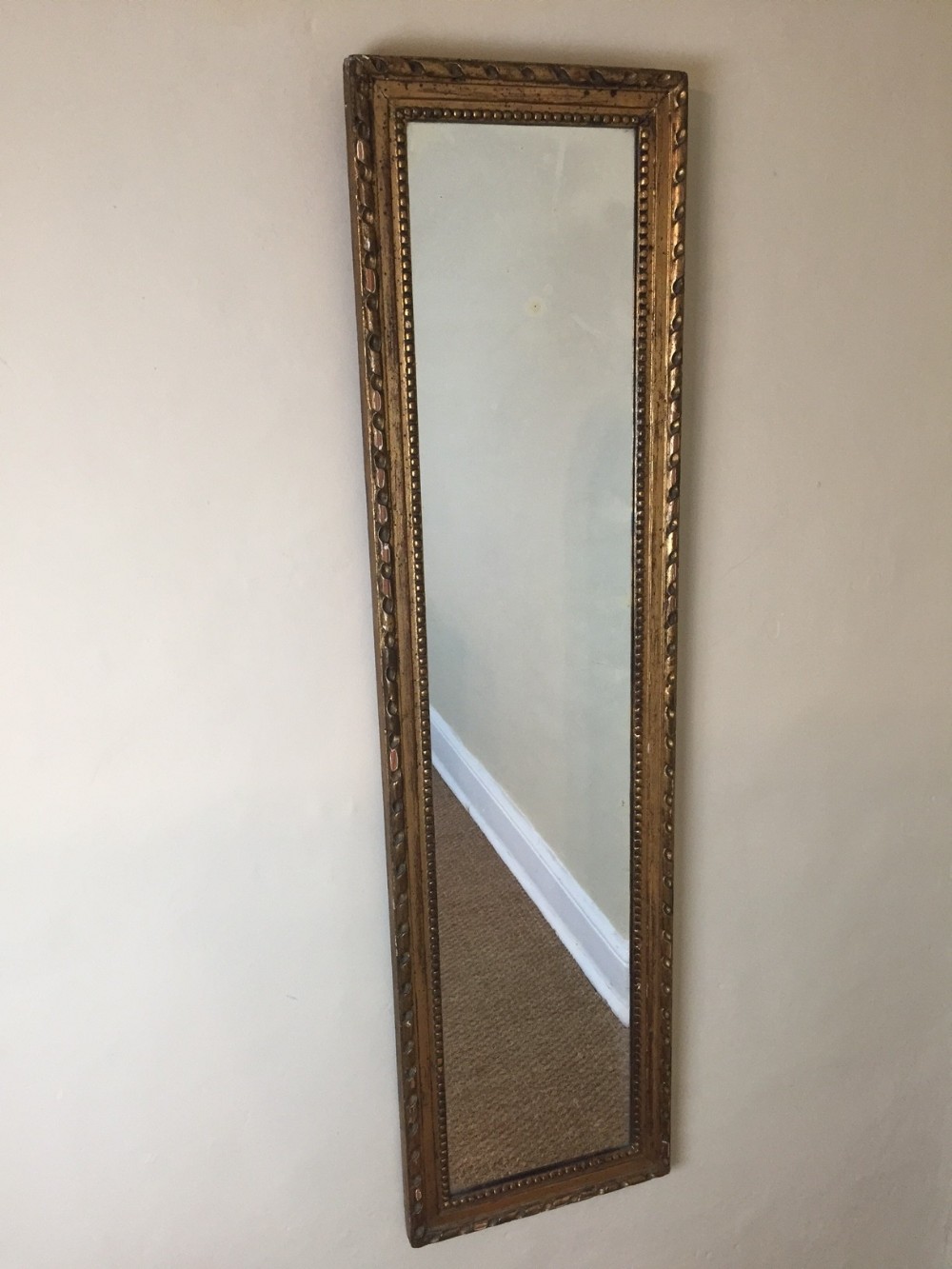 A late Regency carved wood gilded thin pier mirror circa 1880