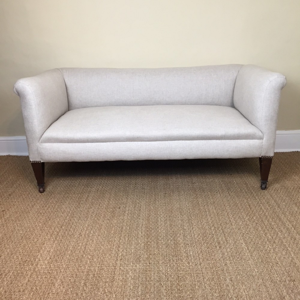 A small Edwardian mahogany sofa circa 1910