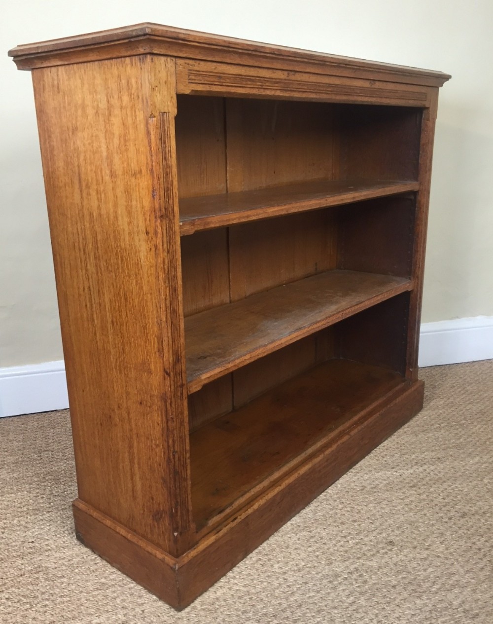 A Victorian honey oak open bookcase circa 1890