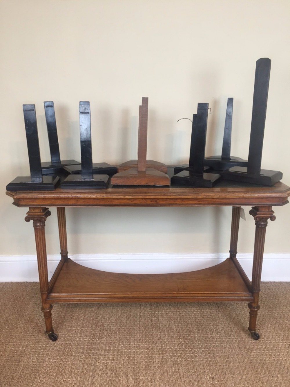 A collection of 10 19th century ebonised mahogany and oak plate stands.