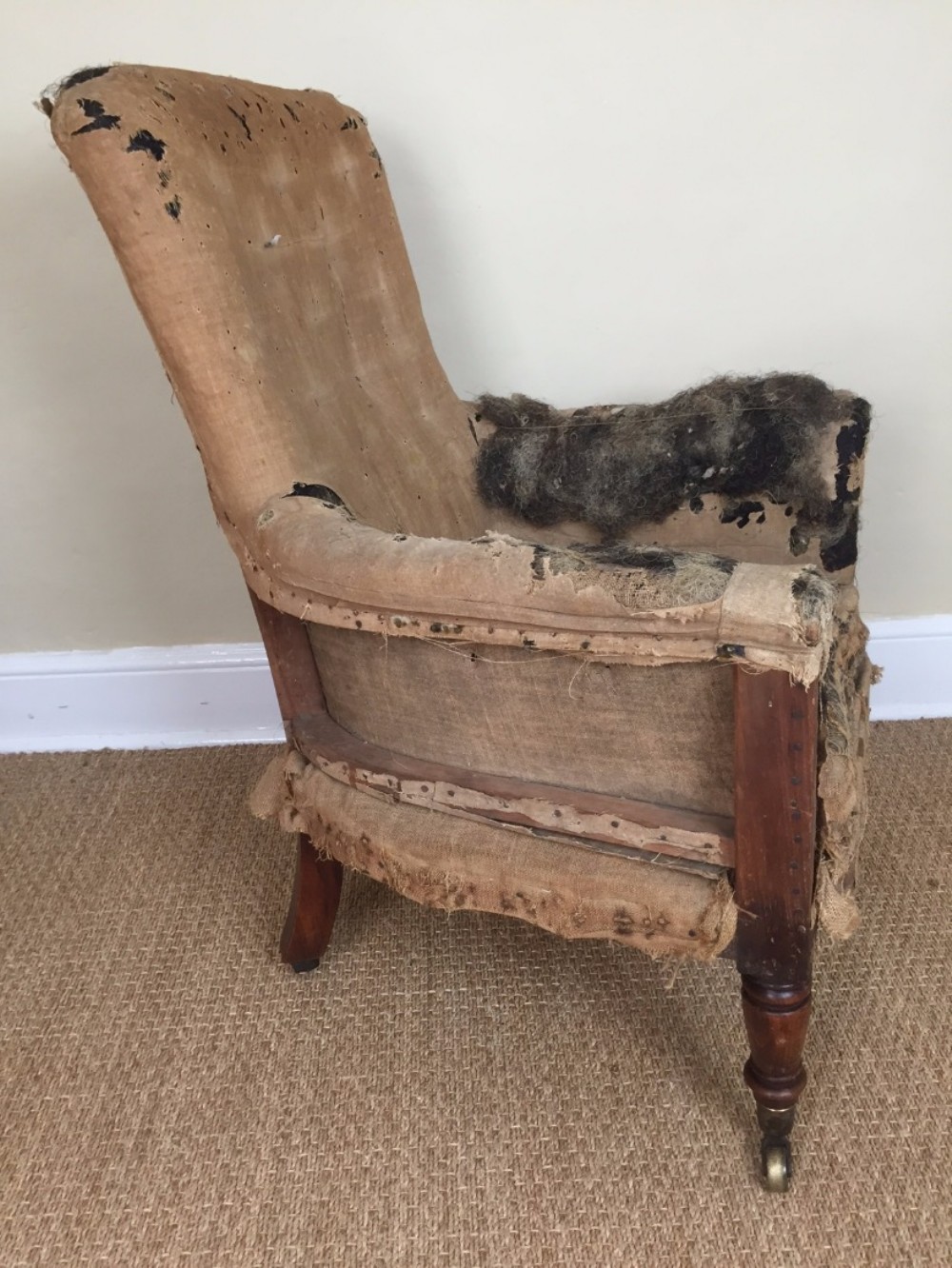 A George IV simulated oak bergere library chair c 1830 for reupholstery.
