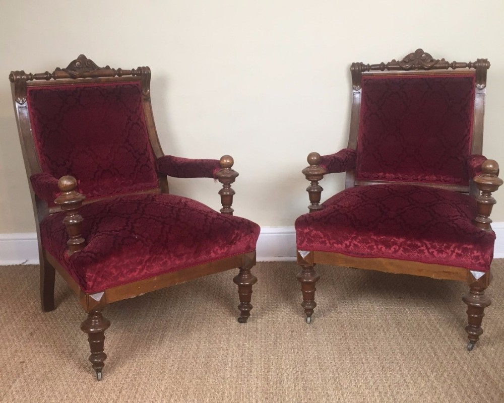 A pair of late 19th-century walnut library chairs for recovery